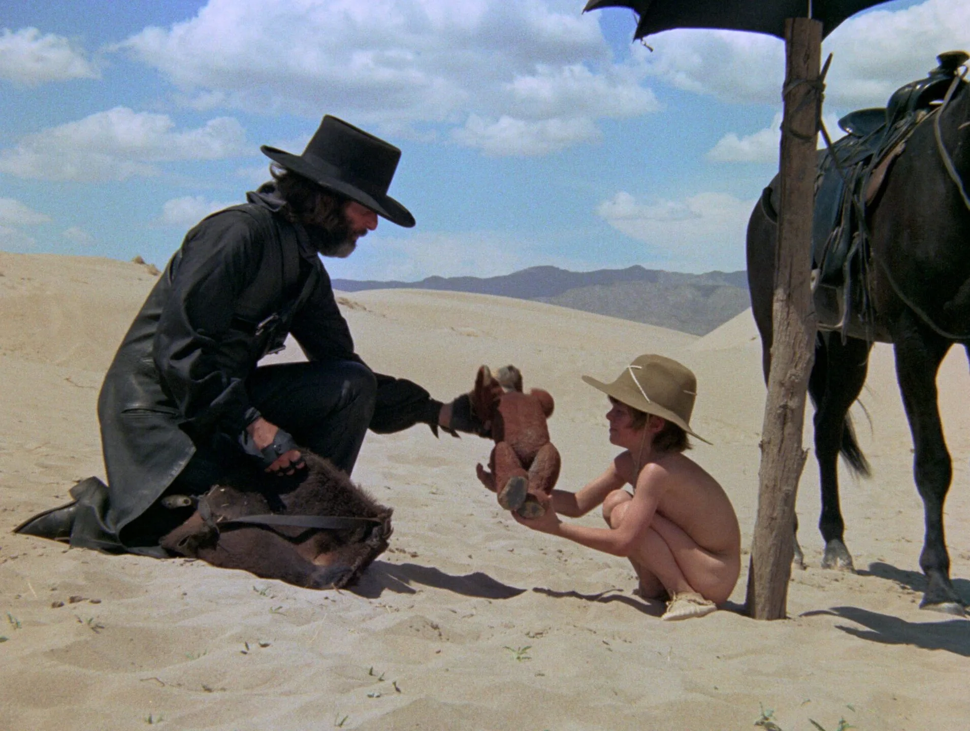 Scene from El Topo — El Topo and his son in the desert