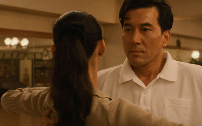 Koji Yakusho as Sugiyama faces his instructor Mai Kishikawa (Tamiyo Kusakari) during a lesson in Shall We Dance? (1996)