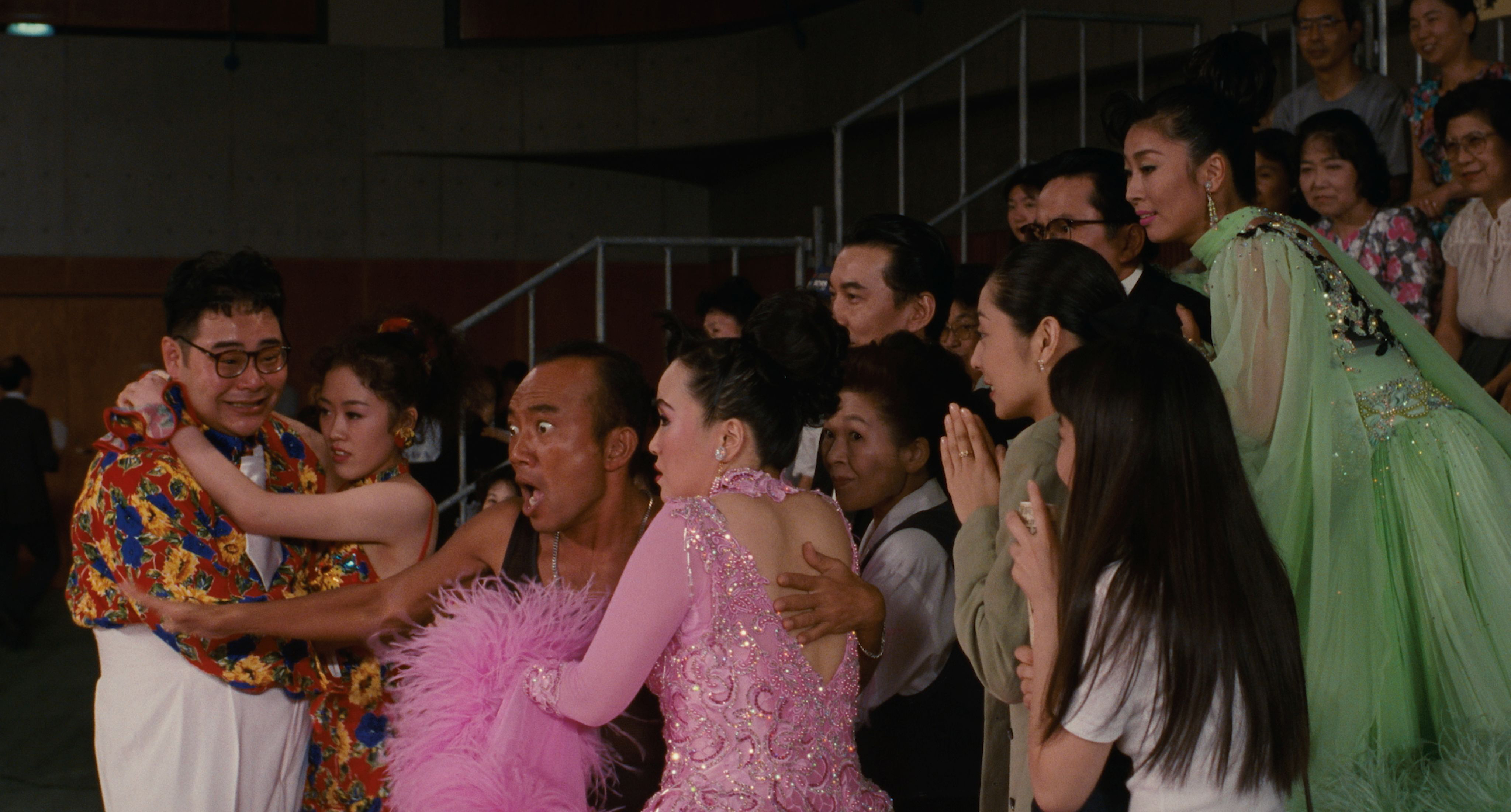 Dancers and friends react with joy and tears at a ballroom competition in Shall We Dance? (1996)