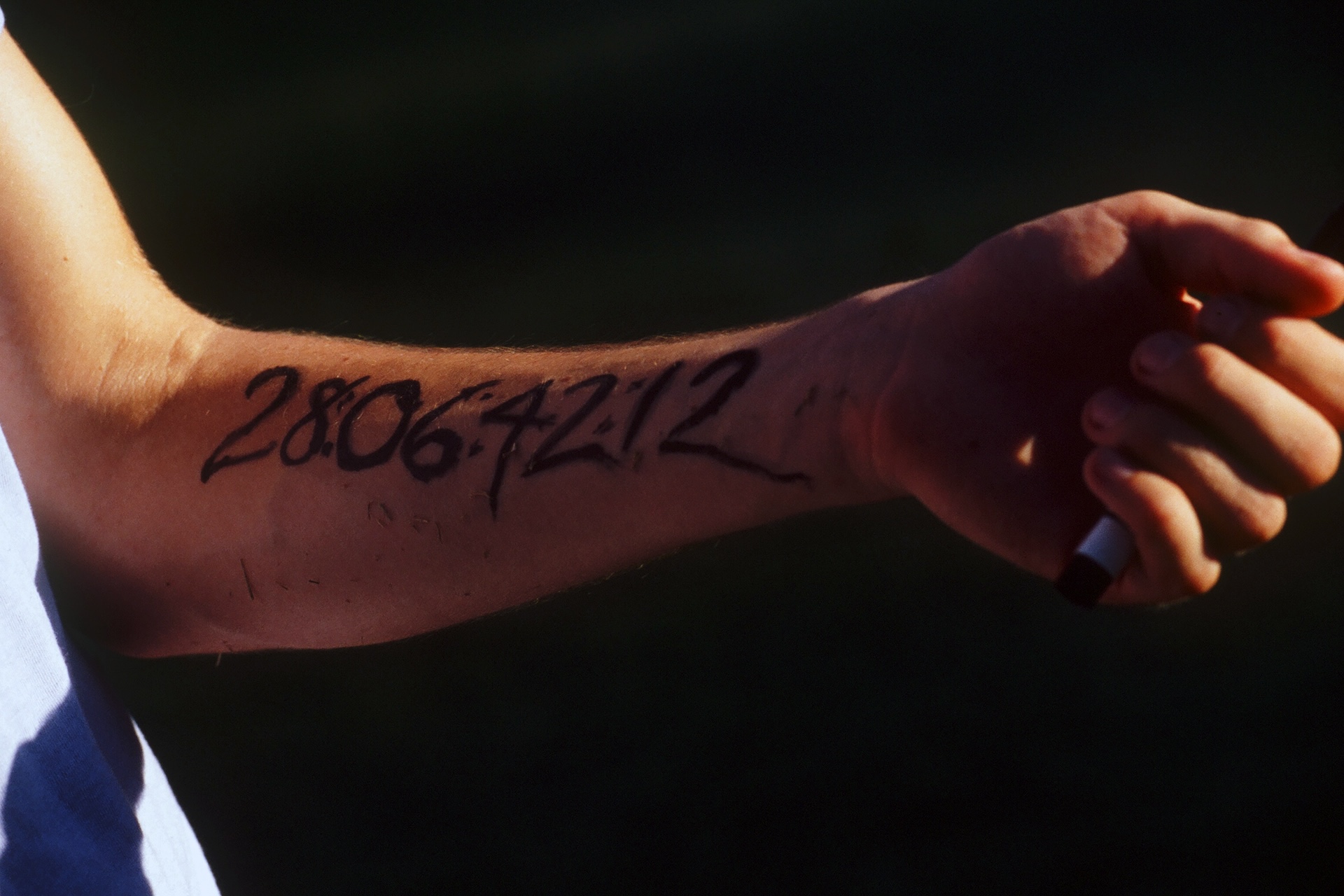 The countdown to the end of the world inked on a forearm in Donnie Darko (2001)