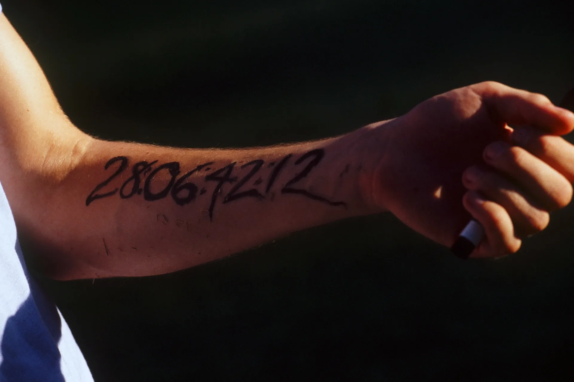 The countdown to the end of the world inked on a forearm in Donnie Darko (2001)