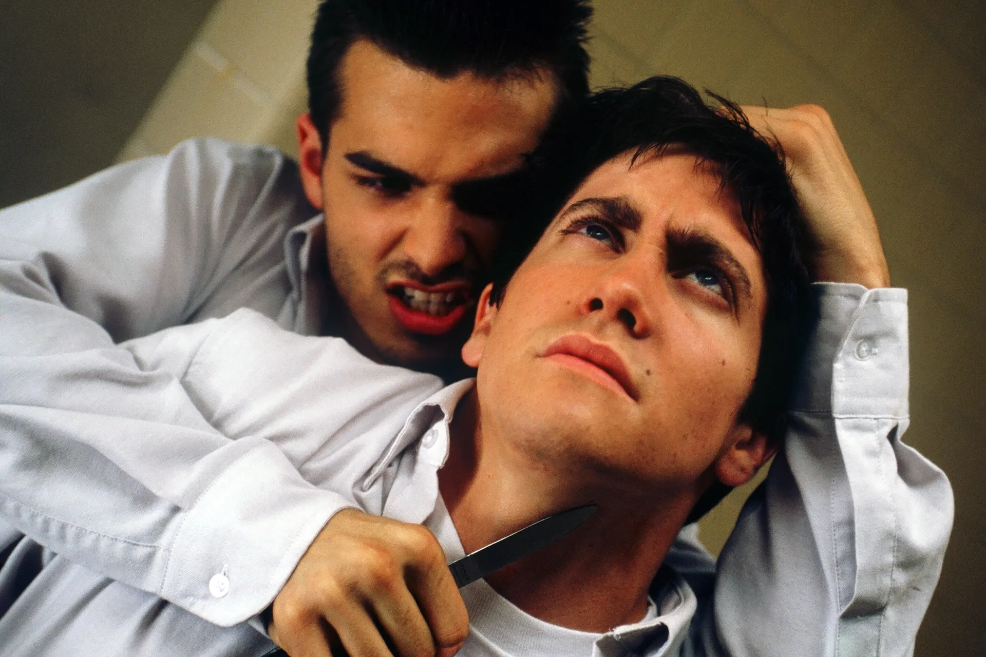 Jake Gyllenhaal as Donnie is held at knifepoint by a school bully in Donnie Darko (2001)