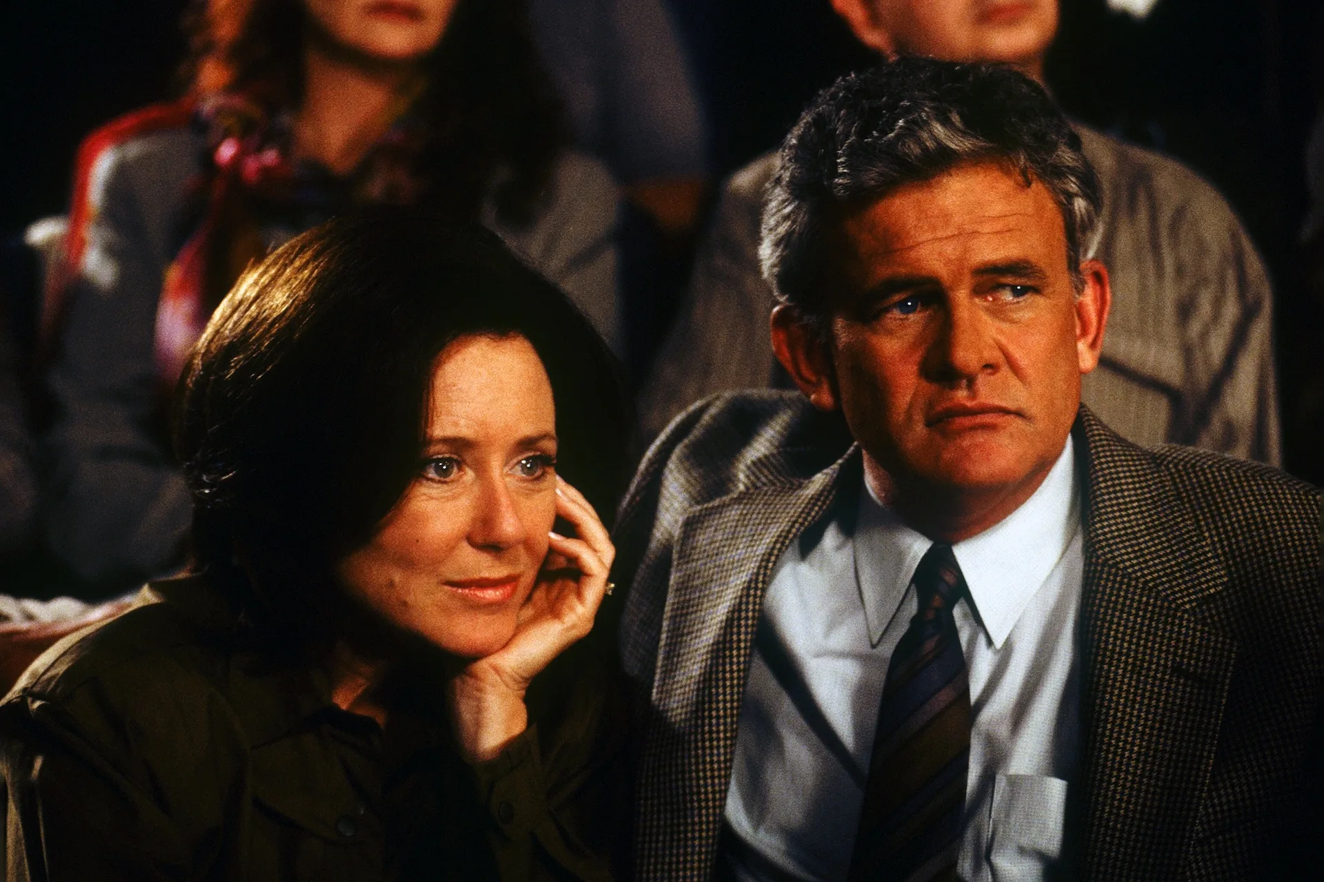 Mary McDonnell as Rose Darko and Holmes Osborne as Eddie Darko watch from a crowded audience in Donnie Darko (2001)