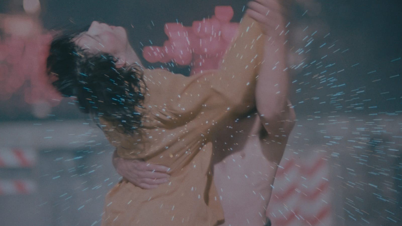 Juliette Binoche as Michèle throws her head back in Denis Lavant’s arms as they dance through a shower of fireworks sparks in Les Amants du Pont-Neuf (1991)